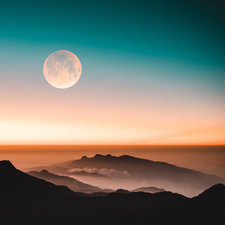 the moon at sunset